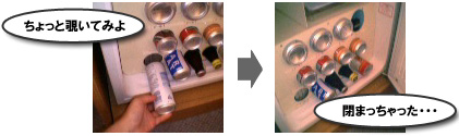 課金型冷蔵庫から缶ジュースを抜き出した画像